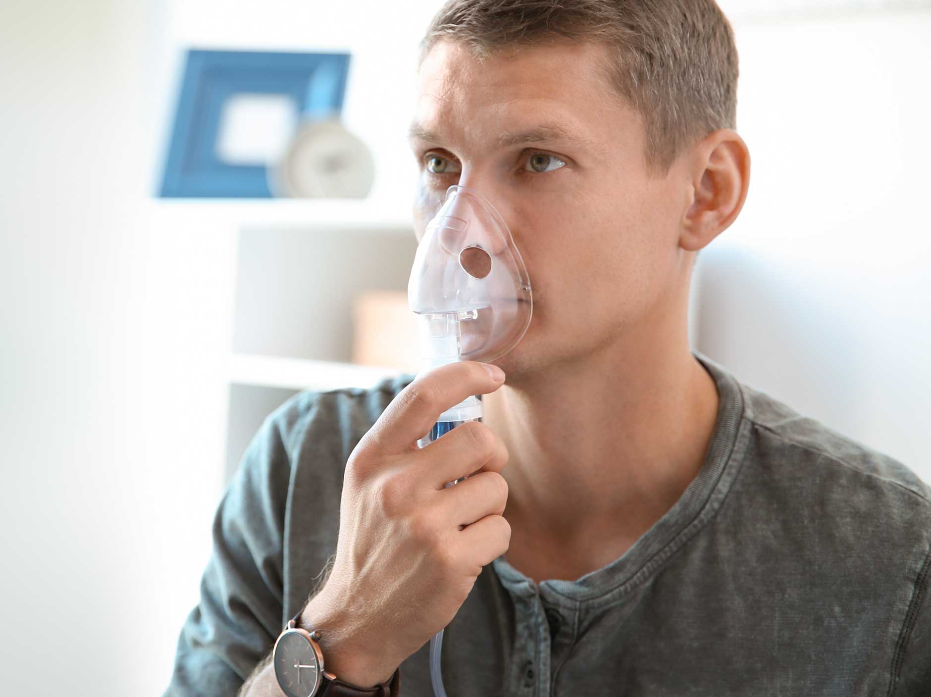 A patient using a nebuliser